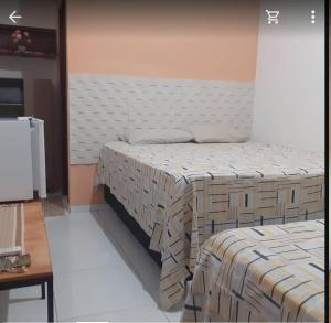 a room with two beds in a room at pousada malva branca in Piranhas