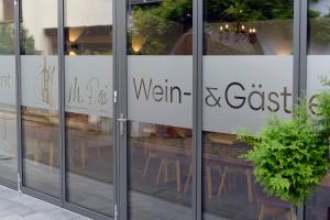 a sign on the glass doors of a restaurant at Wein- und Gästehaus M. Bai in Mesenich