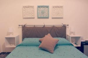 Ένα ή περισσότερα κρεβάτια σε δωμάτιο στο B&B La Peonia