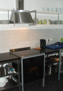 A kitchen or kitchenette at Ording Beach Hotel