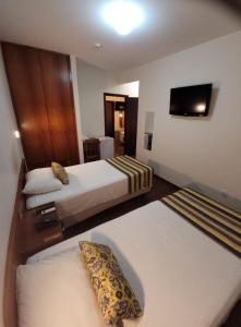 Katil atau katil-katil dalam bilik di Hotel Giordano Centro