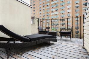 a balcony with chairs and a hammock on a building at 1597-PHN PH Duplex -Private Outdoor 2bath in New York