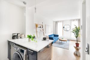 a kitchen and living room with a washing machine at 1597-PHN PH Duplex -Private Outdoor 2bath in New York