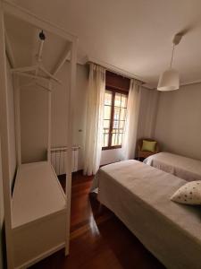 Postel nebo postele na pokoji v ubytování Apartamento en Sarón a 5 min de Cabárceno + 7 fotografií