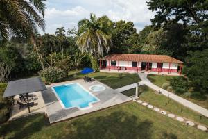an aerial view of a house with a swimming pool at Finca Hotel El Balso Armenia, Quindío in Armenia