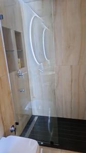 a bathroom with a shower with a sink and a toilet at Bel appartement familial résidence sécurisée in Casablanca