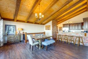 a kitchen and dining room with a table and chairs at Beech Mountain Home with Game Room and Mountain Views! in Beech Mountain