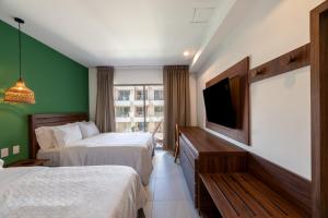 Postel nebo postele na pokoji v ubytování Holiday Inn Tulum by IHG