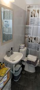 a bathroom with a sink and a toilet at Sweet Home Nikorenia 2 in Krotiri +55 photos