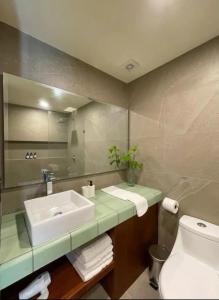 a bathroom with a sink and a toilet at BOHO Loft Steps from the Beach in Holbox Island +45 photos