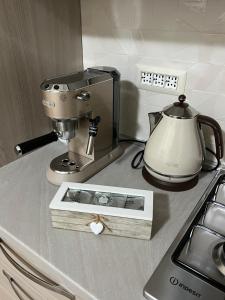 A kitchen or kitchenette at Casa vacanze l’orchidea