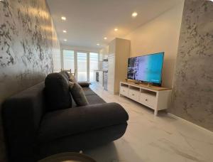 TV a/nebo společenská místnost v ubytování IL punto + 6 fotografií