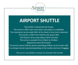 a sign that reads airport shuttle the shuttle is shared and has seats the service at Airport Hotel Bergamo in Bagnatica