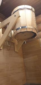 a chandelier hanging from a ceiling in a room at Jugland-Private Riverside Retreat with Sauna & Hot Tub in Bajāri +44 photos