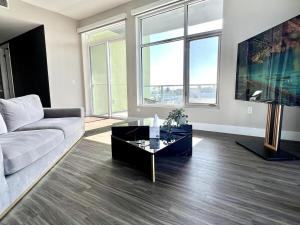 a living room with a couch and a table at Hollywood Sign View 2 Bed 2 Bath Premium Corner in Los Angeles