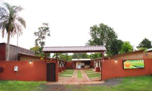 a building with a sign on the side of it at Litoral Apart in Eldorado