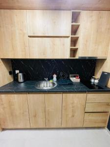 Η κουζίνα ή μικρή κουζίνα στο Alpine Breza Apartments