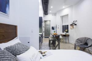 a bedroom with a bed and a table and chairs at 3-2 Prime East Village Private outdoor in New York