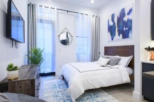 a bedroom with a large bed and a television at 3-2 Prime East Village Private outdoor in New York