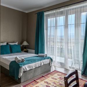 Postel nebo postele na pokoji v ubytování Tsaghkunk Chef House Hotel & Restaurant