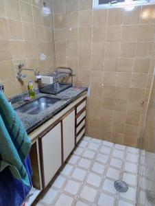 a bathroom with a sink and a shower at Casa loft Internet 500Mb in Sao Paulo