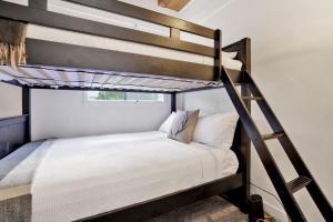 a bedroom with two bunk beds in a room at Large Bear Lodge by Big Bear Vacations in Sugarloaf