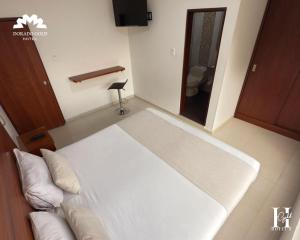 Postel nebo postele na pokoji v ubytování Hotel Dorado Gold