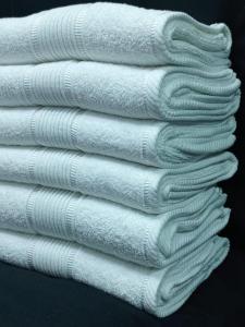 a stack of white towels sitting next to each other at Staycation in Nairobi
