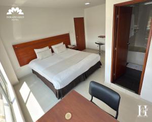 Postel nebo postele na pokoji v ubytování Hotel Dorado Gold