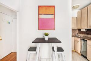 a small table in a kitchen with two stools at 350-1A Gramercy New 1BR Sleeps3 Newly Furnished in New York