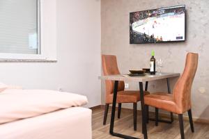 TV a/nebo společenská místnost v ubytování Studio Idila