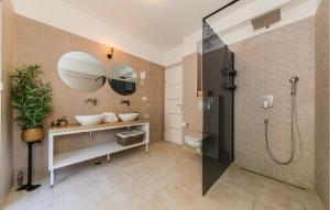 a bathroom with a shower and a sink and a toilet at Nice Home In Kastel Stari With Jacuzzi in Kastel Stari