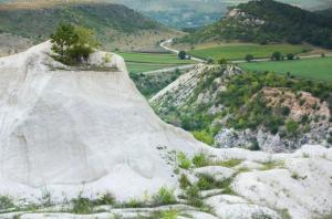 a large pile of snow on a mountain at La Ursan in Feteşti