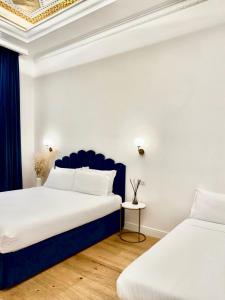 Postel nebo postele na pokoji v ubytování SM Mellini Relais B&B