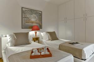 Katil atau katil-katil dalam bilik di An amazing apartment in Oltrarno