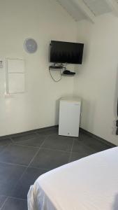 a room with a flat screen tv on the wall at Gab house in Capesterre-de-Marie-Galante