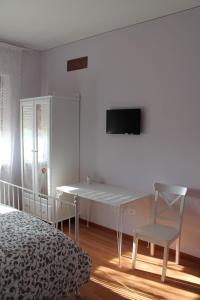 TV a/nebo společenská místnost v ubytování Sogni d'Assisi