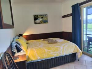 Voodi või voodid majutusasutuse Daintree Riverview Lodges toas