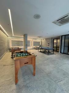 a room with ping pong tables and ping pong balls at Apto Premium Resort in Salinópolis