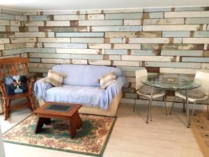 a living room with a couch and a table at Lark Rise B&B in Wangford +11 photos