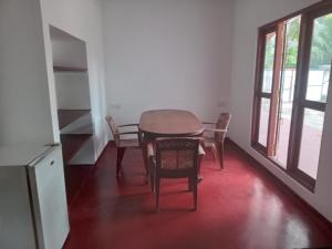 a dining room with a table and chairs at Villa Paradiso in Wadduwa