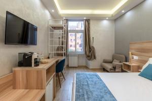 TV a/nebo společenská místnost v ubytování Rome Love Hotel
