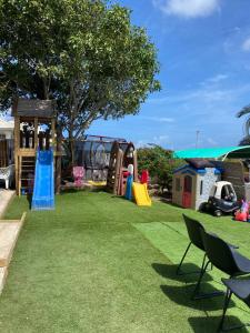 a backyard with a playground and a play park at 4BlessingsCuracao2 in Willemstad