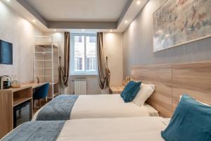 Postel nebo postele na pokoji v ubytování Rome Love Hotel