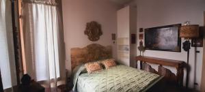 a bedroom with a bed and a large window at B&B Fuori Dai Coppi - Bologna in Bologna