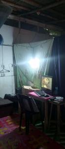 a room with a desk with a laptop computer on it at Payag Ni Bodeng in Talusan +10 photos