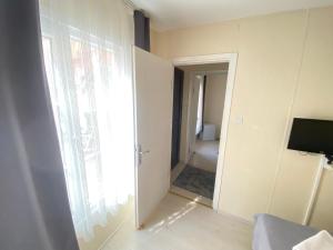 a room with a door leading to a bathroom at Ali Baba Butik Otel in Gündoğdu +14 photos