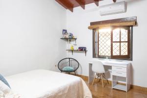 Postel nebo postele na pokoji v ubytování La Luqueña House