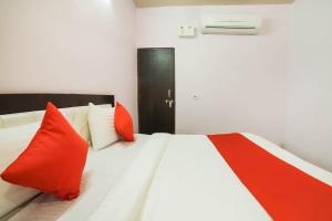 Postel nebo postele na pokoji v ubytování Hotel O Iris Lite