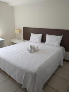 Ένα ή περισσότερα κρεβάτια σε δωμάτιο στο Flat Beira Mar em Manaíra - Aptos de 2 Quartos